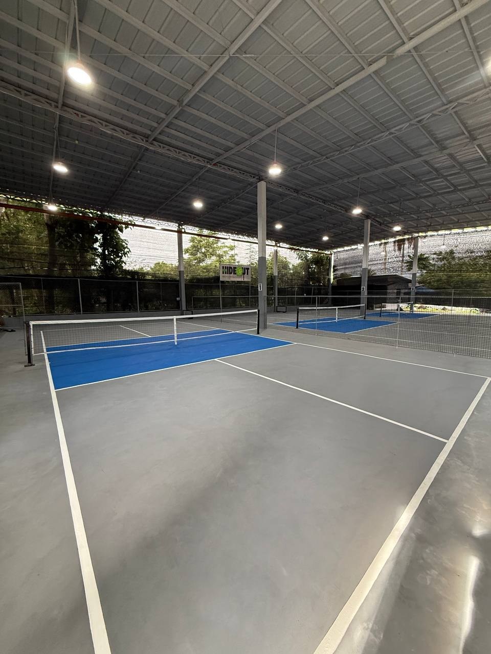 Two covered HIDEOUT courts under the metal roof