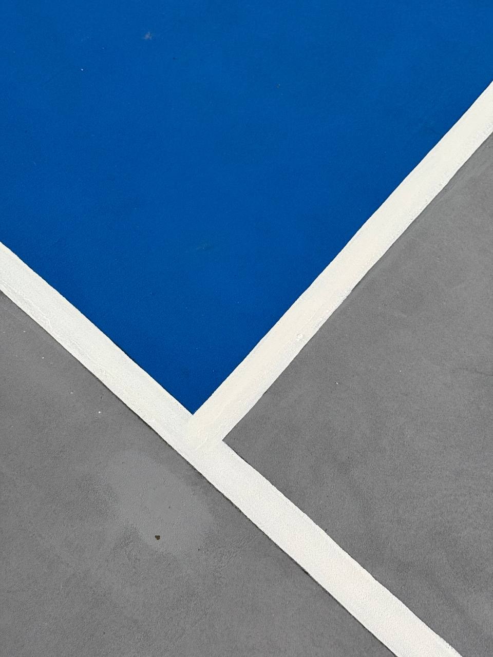 Blue kitchen, gray court, and white lines at HIDEOUT