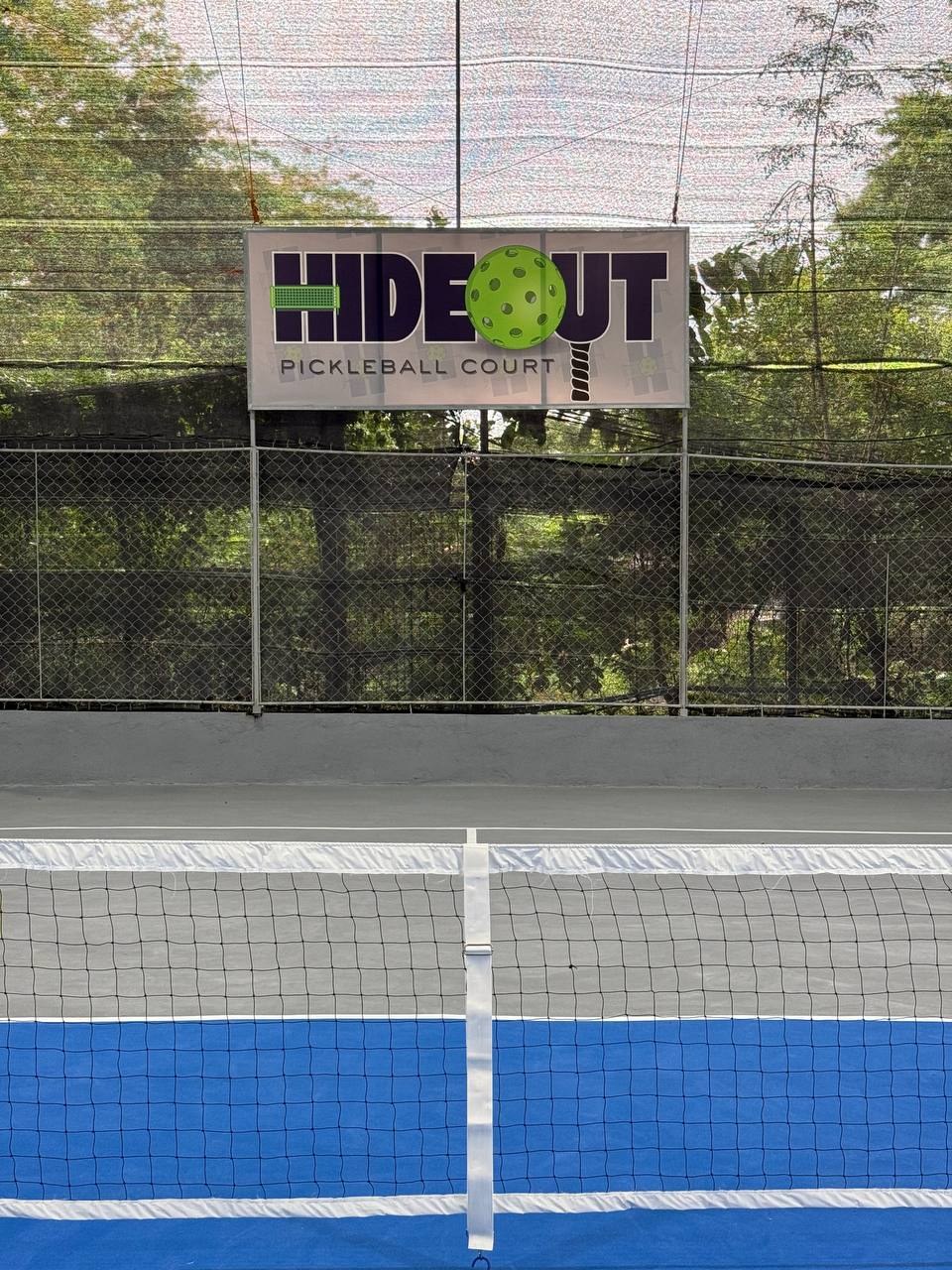 HIDEOUT Pickleball Court sign above the net